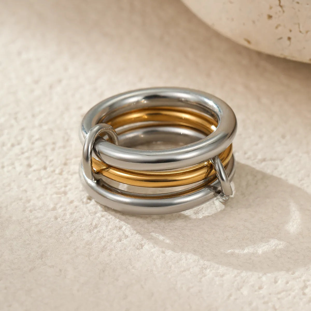 Stacked colour matching stainless steel ring with 18K gold plating, exaggerated design
