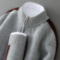 Men's slim fit half zip wool sweater in grey, showing round neck and regular sleeves.