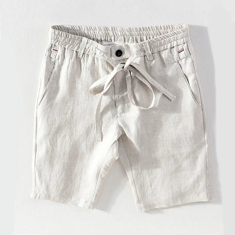 Men's 100% linen straight shorts in black, front view, mid-waist with zipper fly and pocket detail