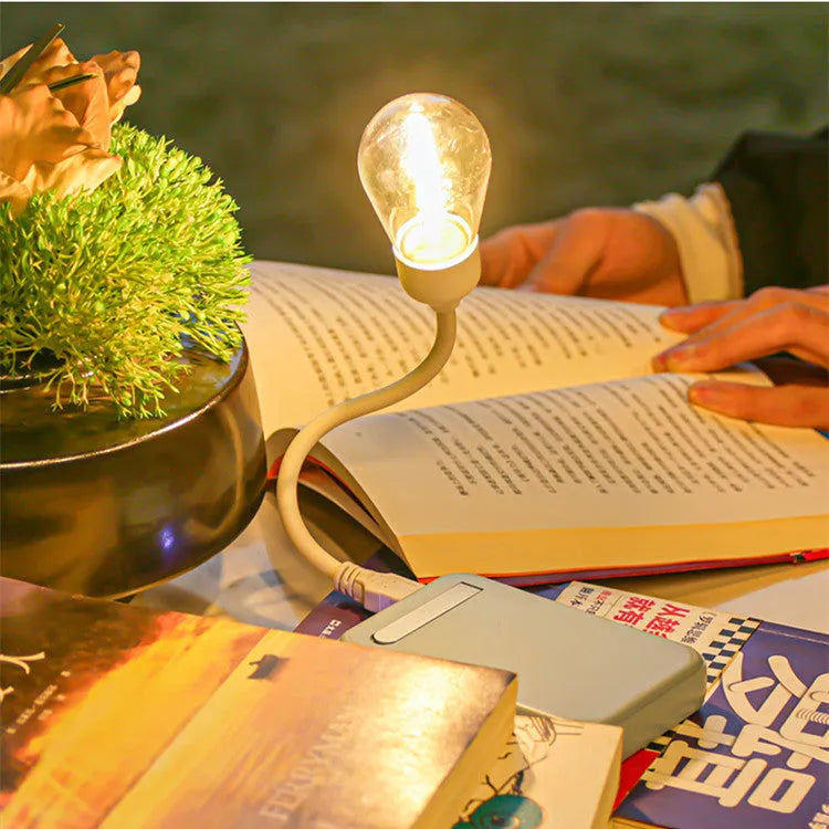 USB rechargeable folding tungsten night light showing warm white illumination