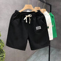 Men's casual sports shorts in white, black or green with micro-elastic polyester fabric