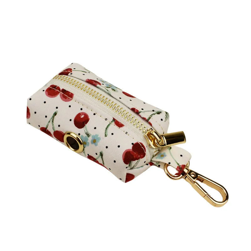 Red cherry printed dog collar and leash set with light gold buckle and bow on cloth material