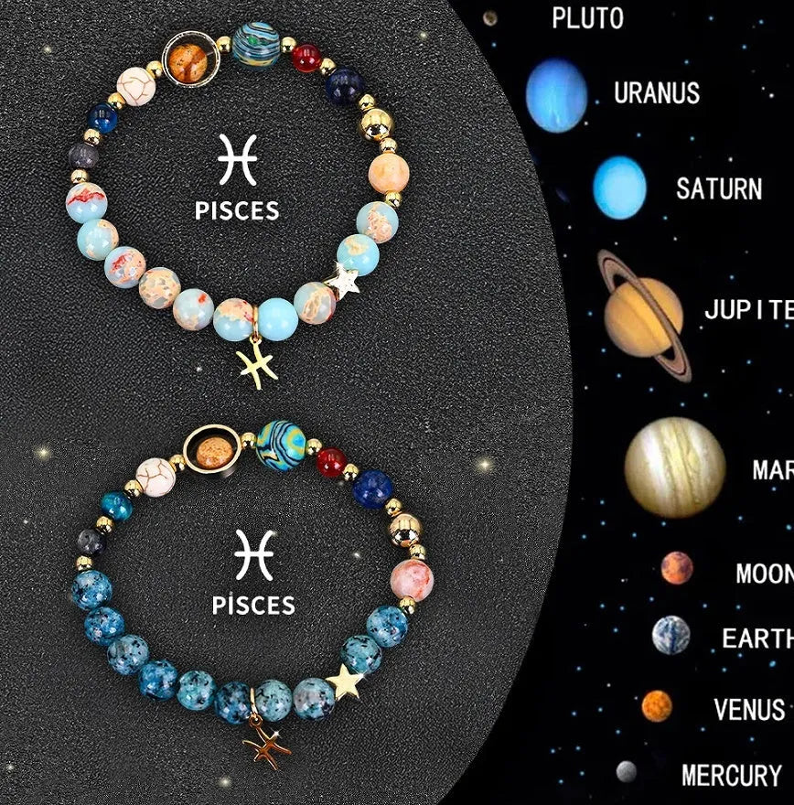 Set of two natural stone beaded bracelets with elastic cords on a wooden surface.