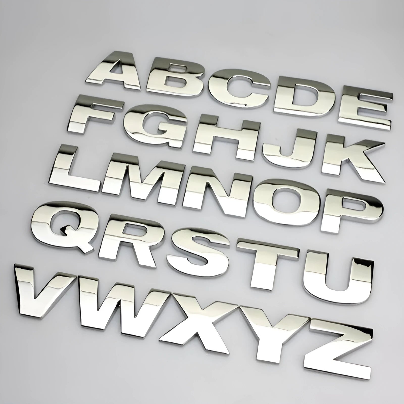 3D metal car bumper stickers showing individual zinc alloy letters in silver and black finishes