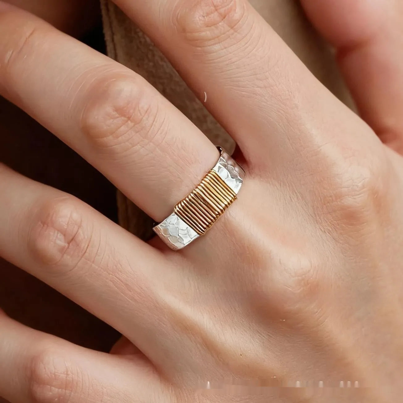 Copper geometric wide ring bracelet with irregular coil design in silver-gold colour.