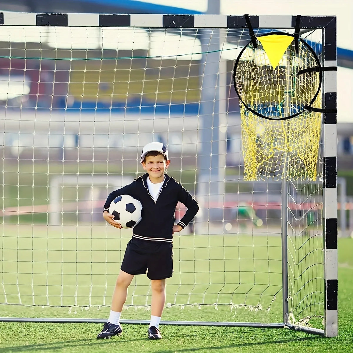 Portable black and yellow football training goal net with four target zones for shooting practice.