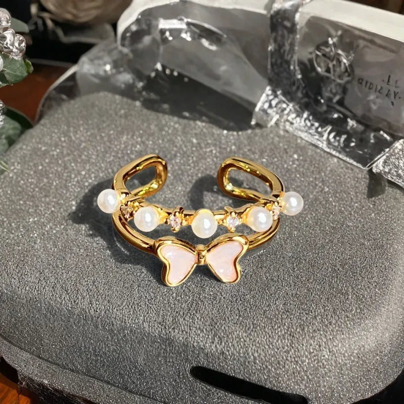Adjustable copper ring with vintage gourd, floral, and bow design in New Chinese style, set with zircon stones.