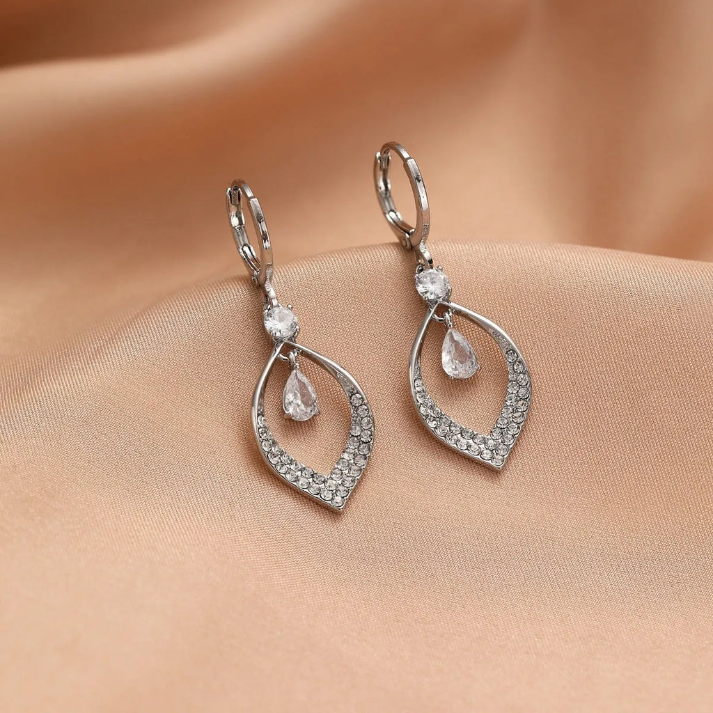 A pair of women's zircon water drop tassel earrings with gold-coloured buckles on a white background.