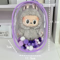 Transparent PVC cube-shaped storage bag with colourful ball keychain for doll drying and organisation.