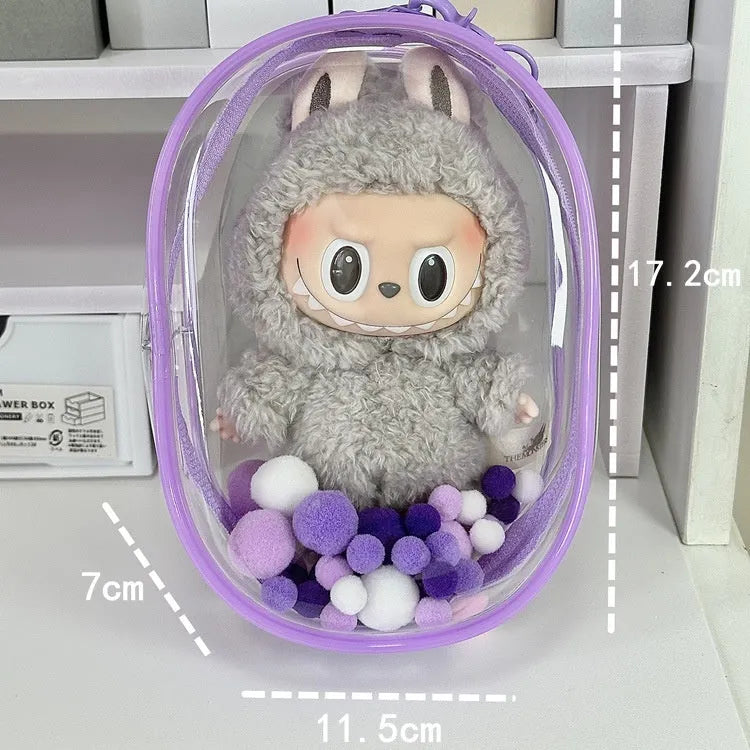 Transparent PVC cube-shaped storage bag with colourful ball keychain for doll drying and organisation.