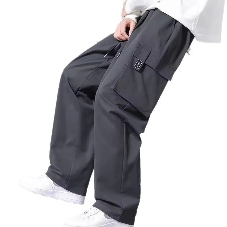 Boys cargo pants with multiple large pockets and drawstring waist in straight leg fit