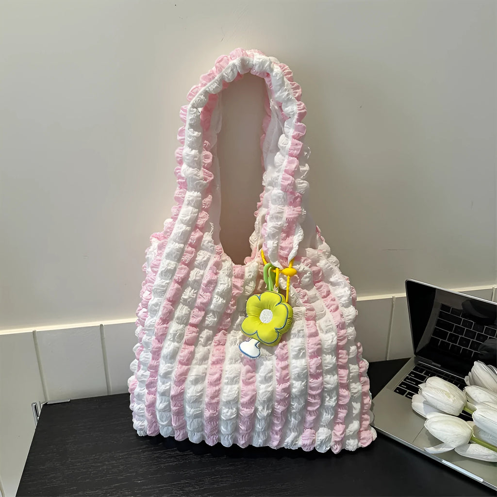 Women's soft pleated bubble shoulder bag in a vertical square shape with a detachable pendant charm.