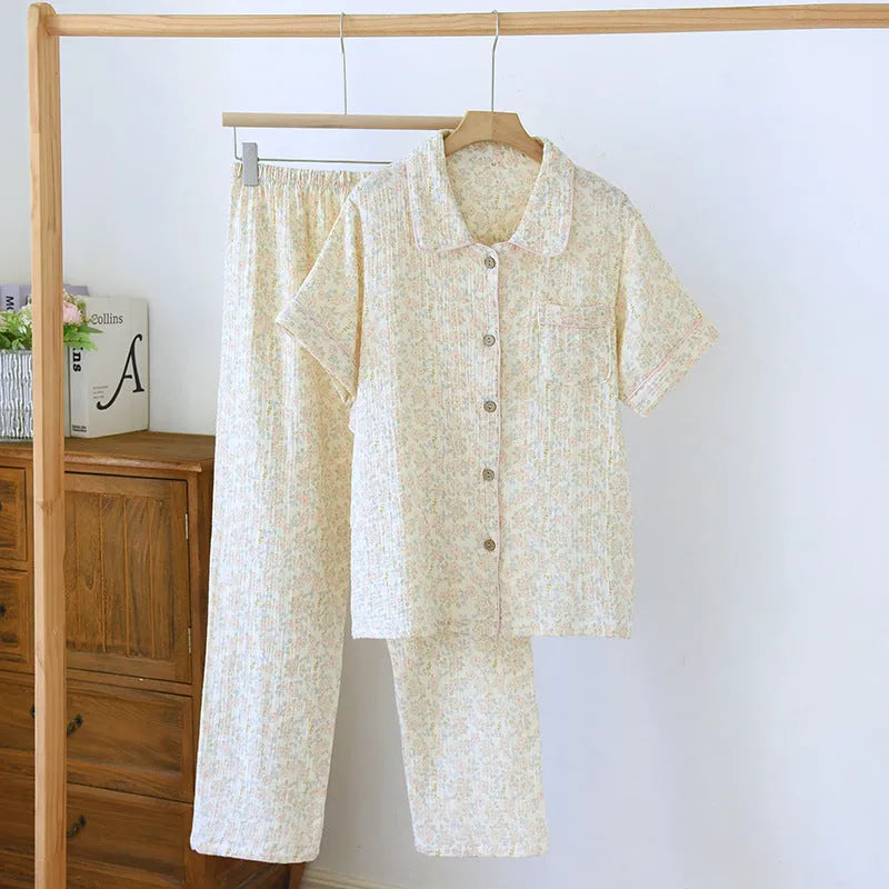 Women's yellow plaid print cotton short-sleeve trouser suit laid flat, showing top and loose-fit trousers.