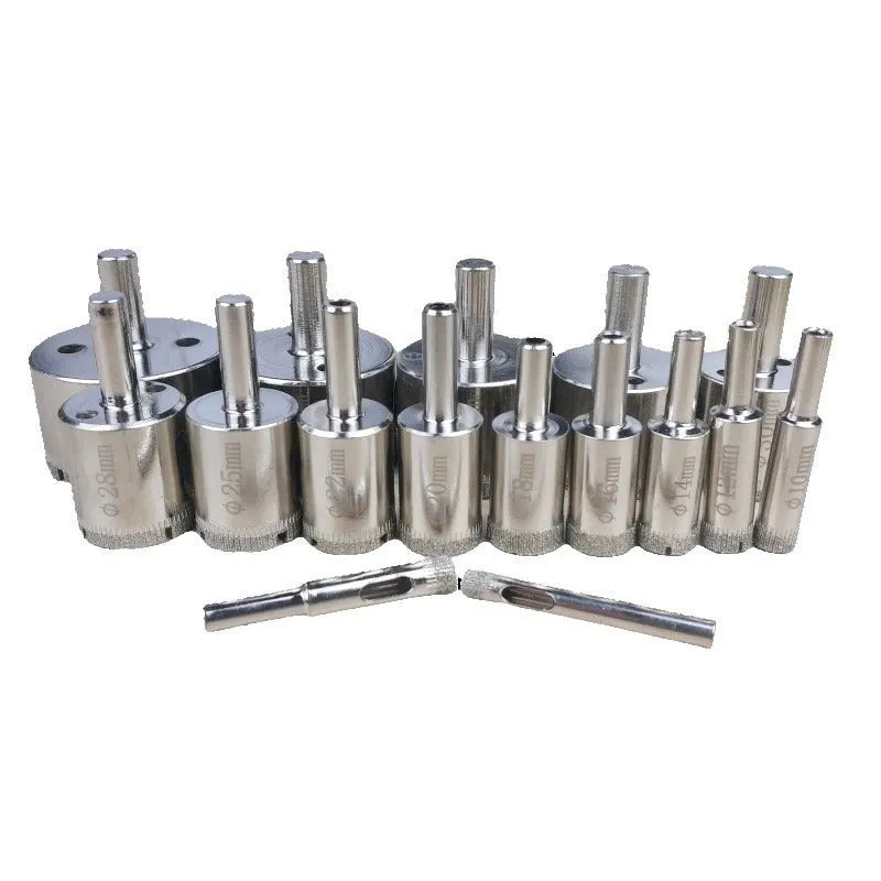 Electroplated tile rock plate drill bit set with one-piece steel construction on a work surface