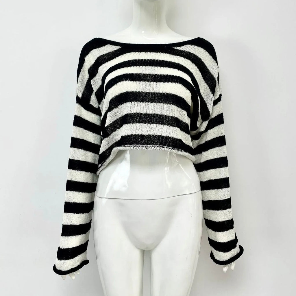 Woman wearing a striped long-sleeve sweater in mercerised cotton, showing front and back wearability with exposed navel detail.