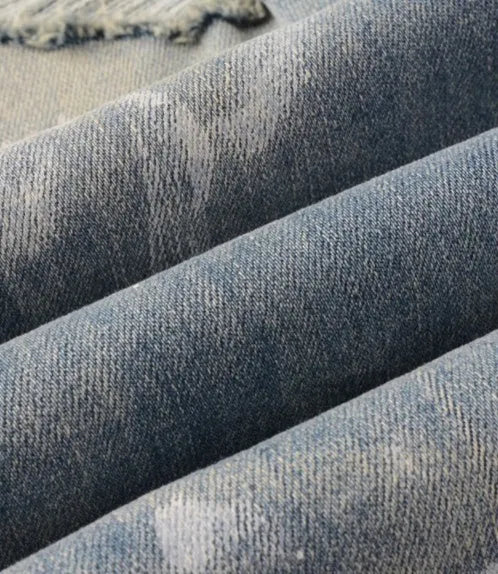 Men's patch slimming perforated leggings in light blue denim cotton, shown on model, multiple sizes available