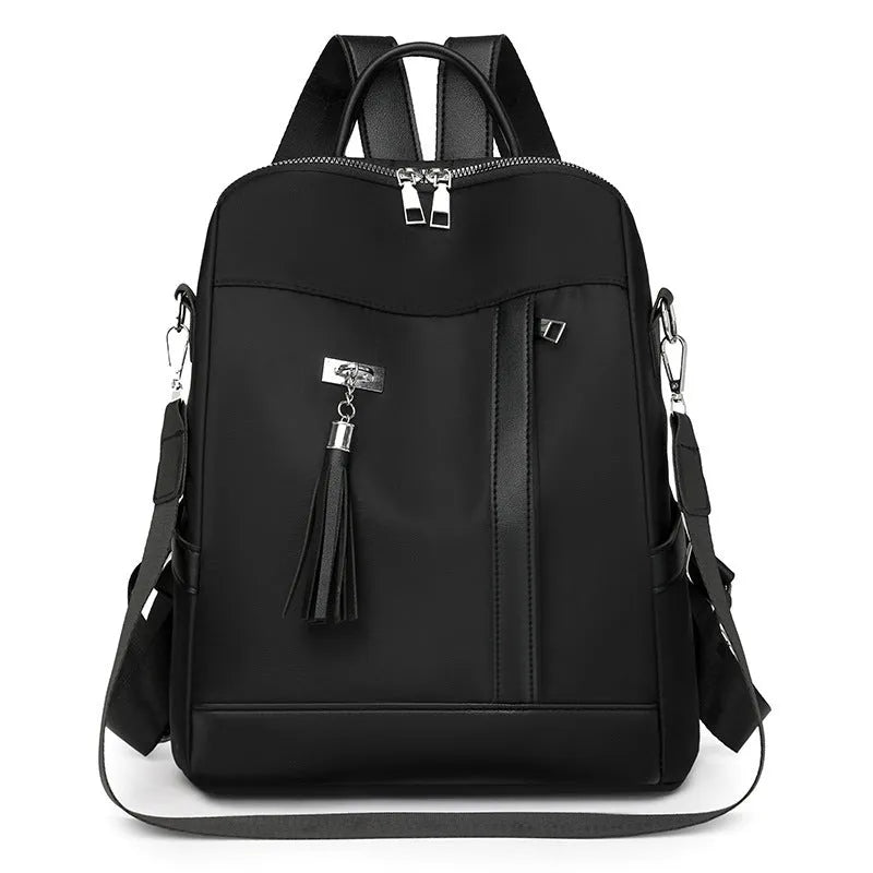 Soft black PU backpack showing three-dimensional front pocket and large main compartment.
