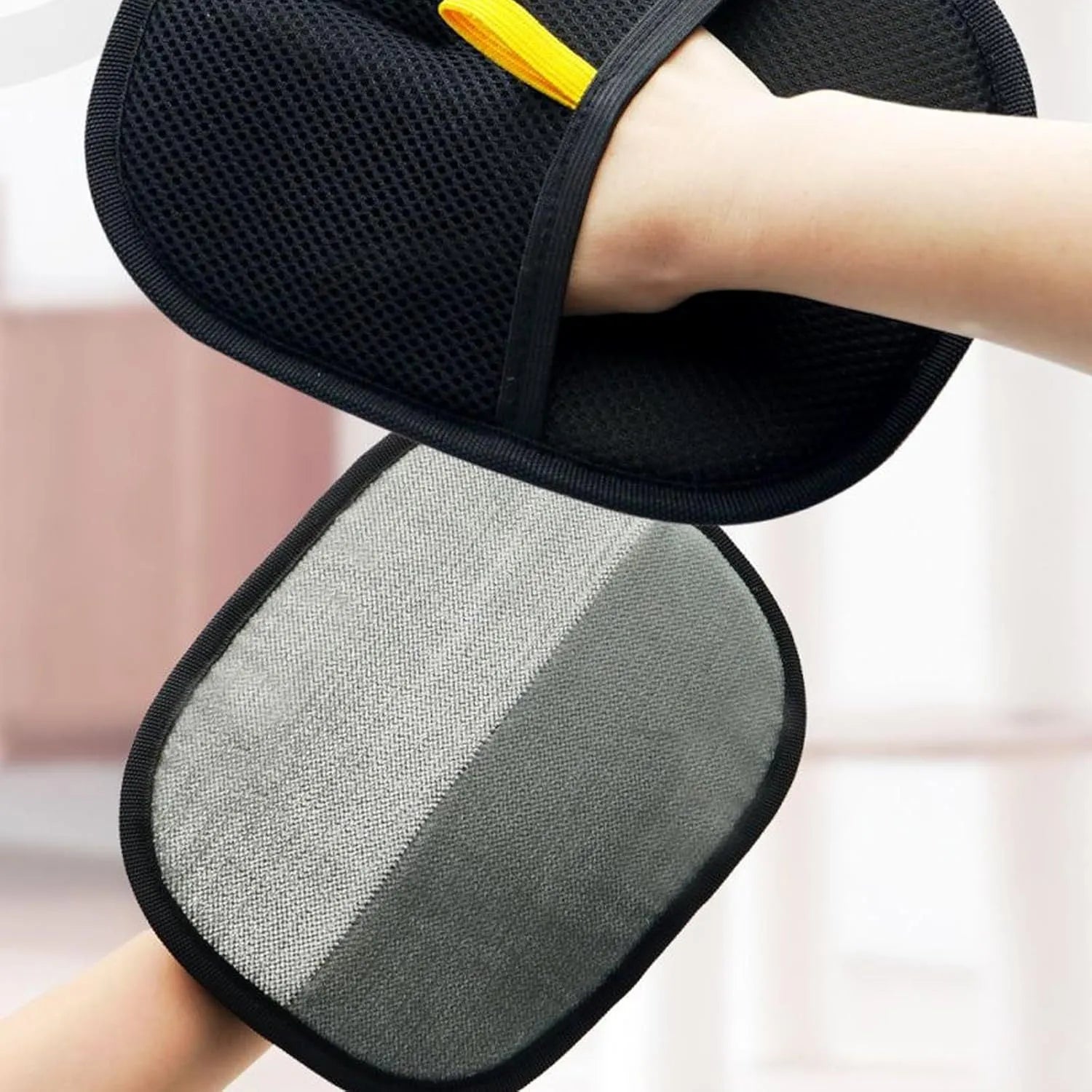 Pet electrostatic hair removal gloves with two-way bristles on a light background
