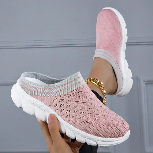 Black women's Flyknit sports slipper with hollowed-out pattern and striped design on a light background.