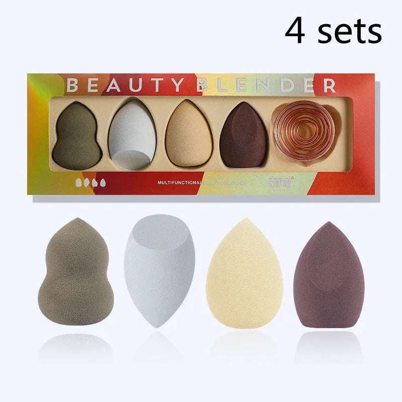 Four coloured hydrophilic polyurethane beauty eggs placed on a metal stand for makeup application