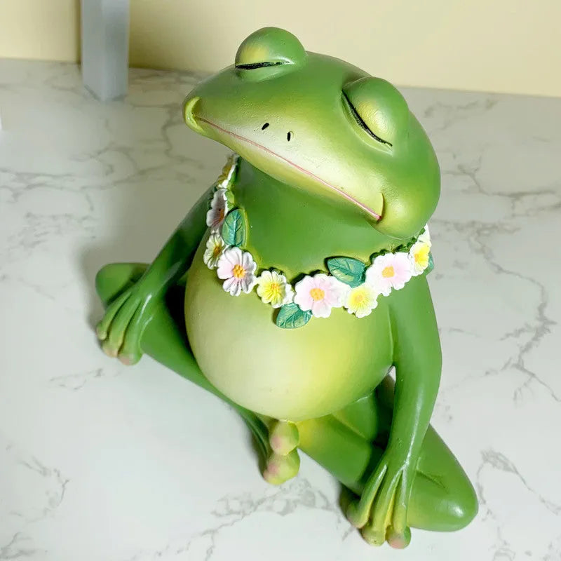 A green European style yoga frog ornament made from plastic and resin for home decoration.