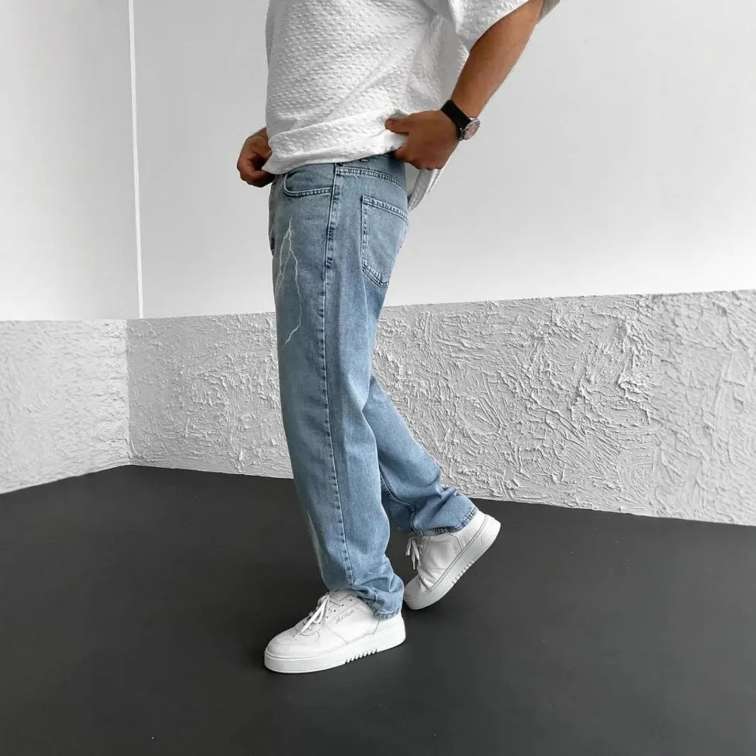 Men's blue straight-leg jeans with loose wide-leg fit and mid-rise waist