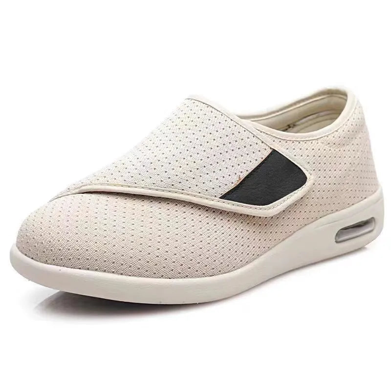 Unisex leisure shoe with hook-and-loop strap on textile upper and foam rubber sole.
