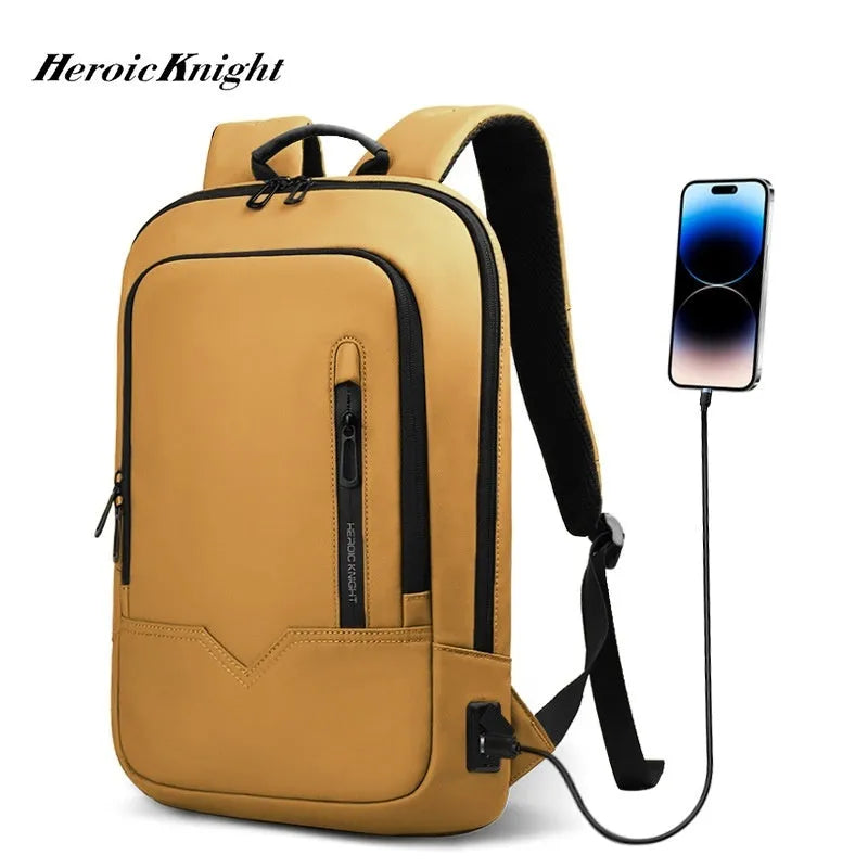 Lightweight solid colour polyester backpack with USB charging port for a laptop.