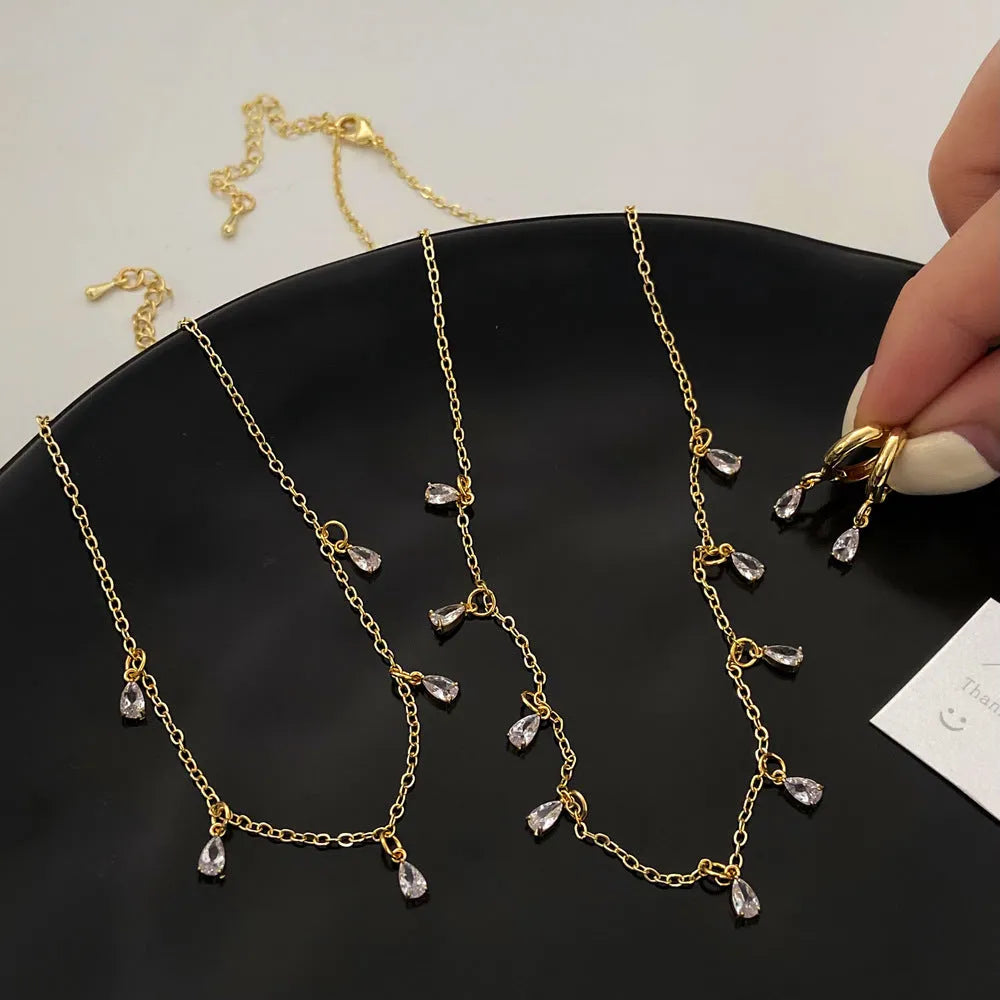 Geometric zircon necklace, earrings, and anklet set in a Korean-style meteor shower design.