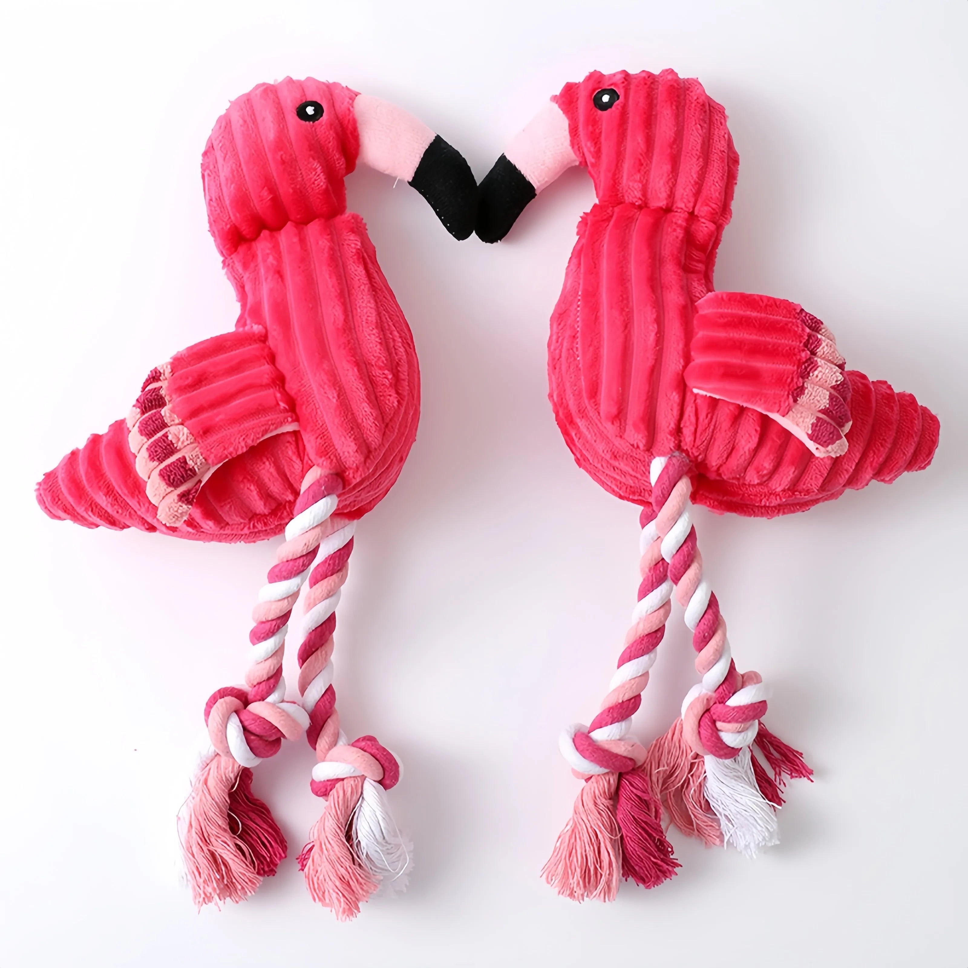 Pink animal-shaped corduroy plush dog toy with a squeaker for small and large dogs.