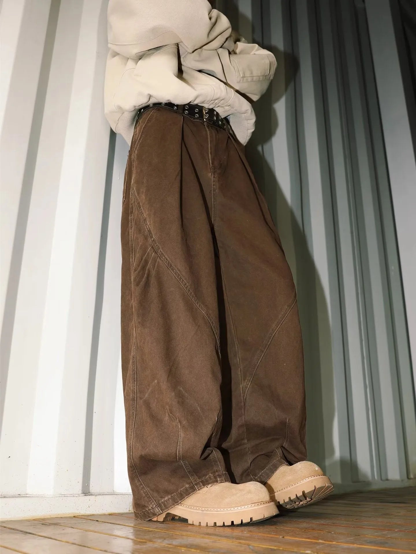Men's loose-fit pleated trousers in a striped pattern, shown in apricot colour with a straight leg.