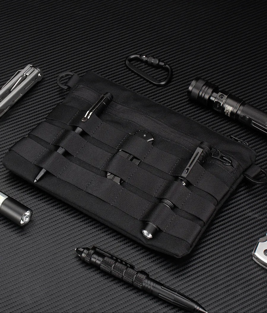 Black Oxford cloth military style outdoor carry bag measuring 18 by 3.5 centimetres