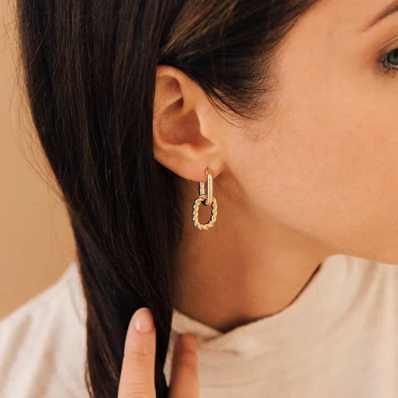 Copper geometric square double ring twist ear clip earrings on display
