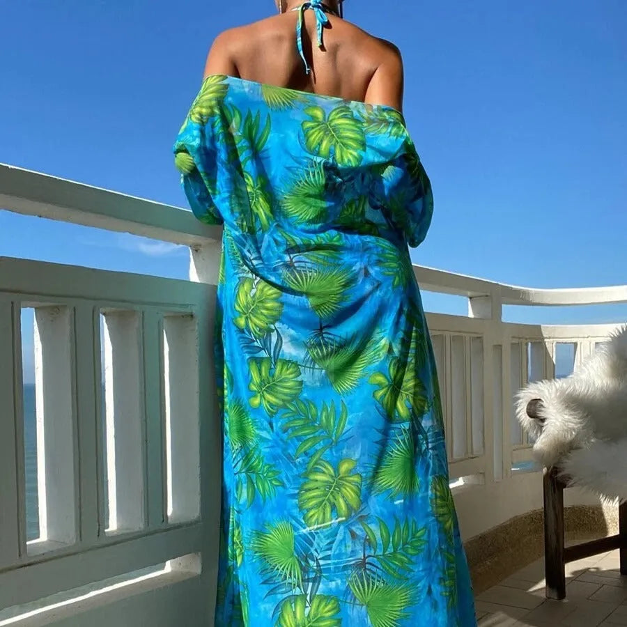 Women's blue banded bikini set with a long-sleeve floral cover-up blouse