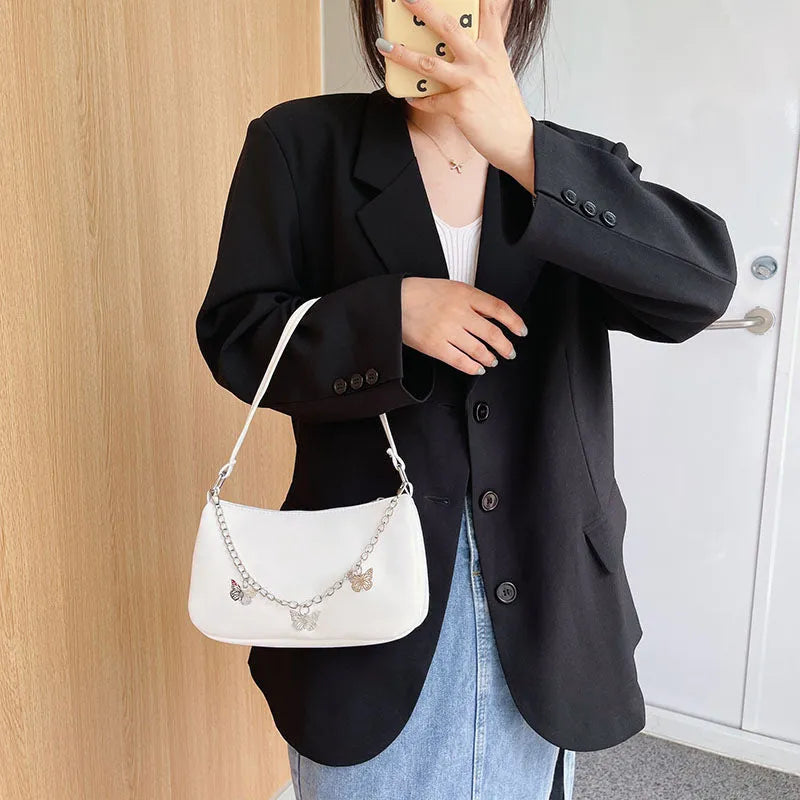 Butterfly chain shoulder crossbody bag in horizontal square shape with separate internal compartments