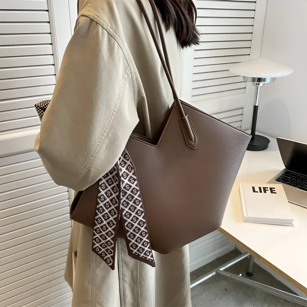 A beige women's large capacity PU shoulder bag with a square shape and a front sandwich pocket.