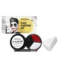 Halloween face painting kit with three colour concealer disc, two brushes, and one sponge on a flat surface