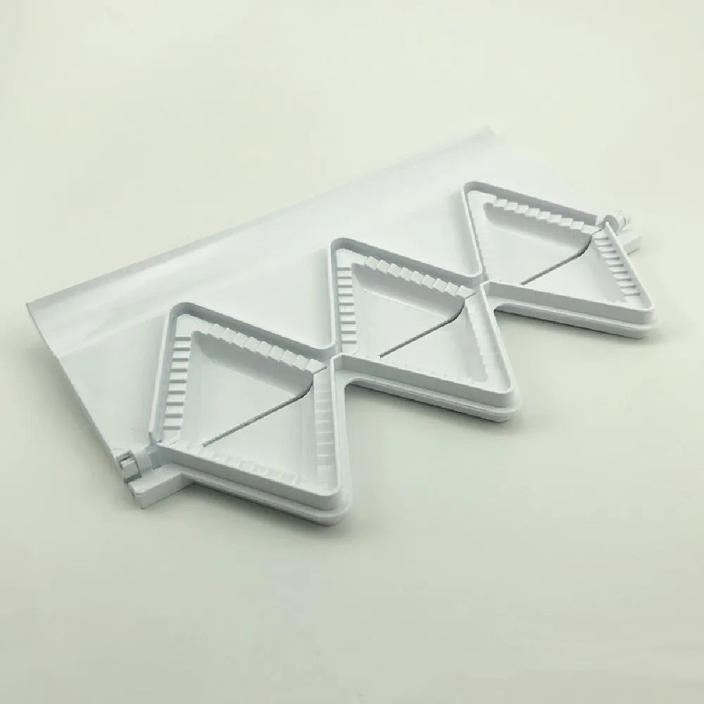 Pure white plastic dumpling maker 28.5cm length on a kitchen counter