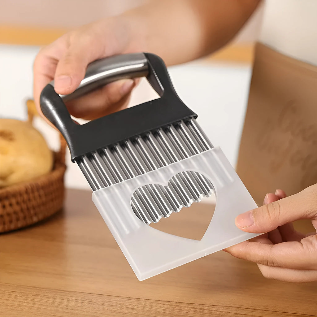 Stainless steel potato wave knife for making crinkle-cut chips on a wooden board.
