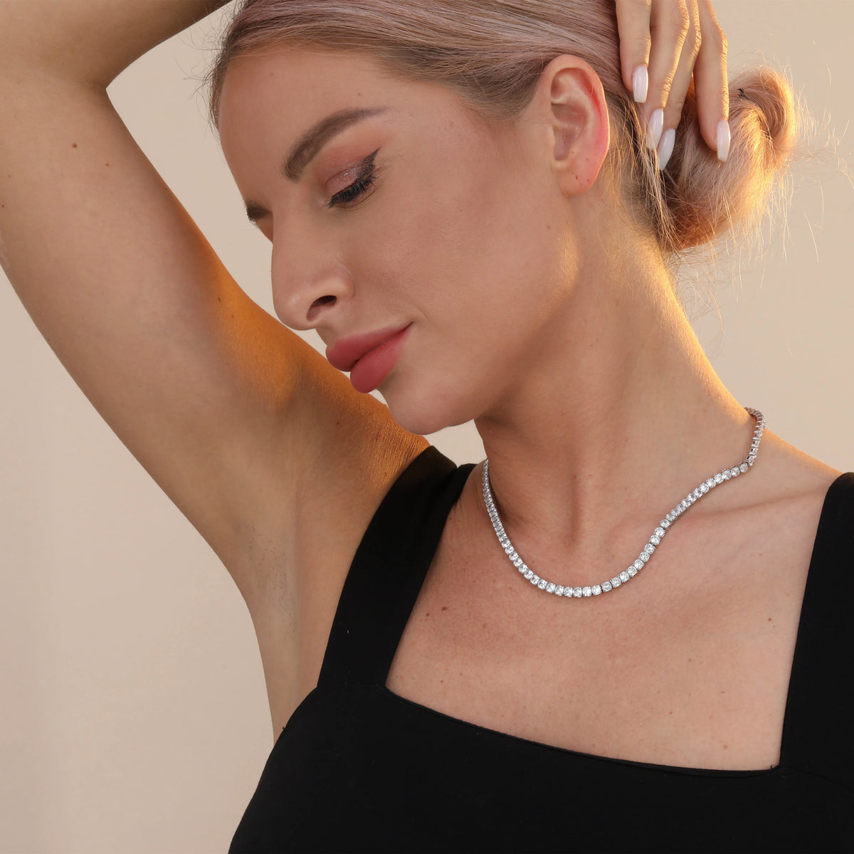 925 sterling silver tennis chain necklace with 4mm cubic zirconia stones and white gold plating on white background