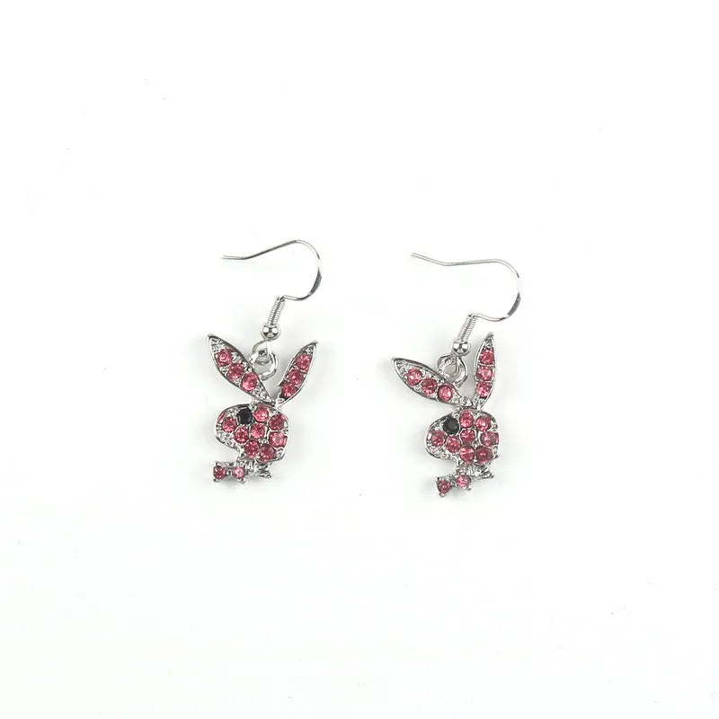 Pair of rabbit-shaped stud earrings with diamond accents on a silver background, showing front and back with butterfly clutch.