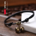 Small dog nylon rope halter collar with brass bell on black, red, and coffee colour backgrounds.