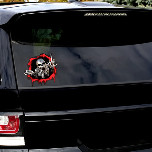 Reflective colourful broken shell peeping metal skull car sticker measuring 15x14cm
