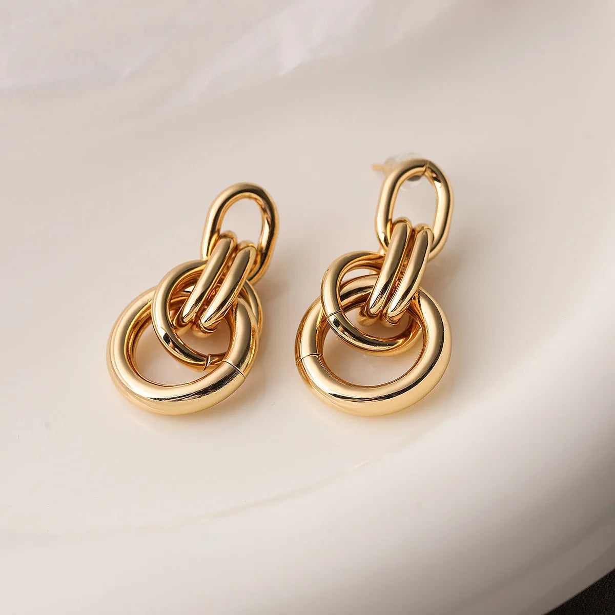 Gold geometric copper earrings with irregular shape for women