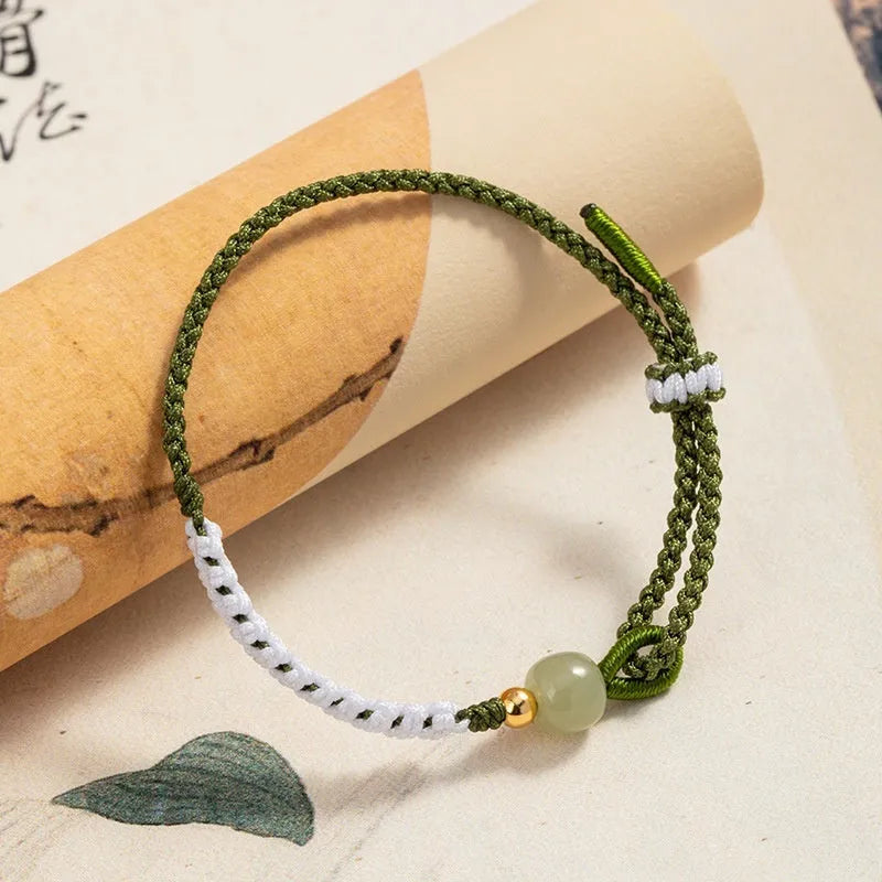 Hetian jade and sterling silver bracelet on a colourful electroplated cord strap.
