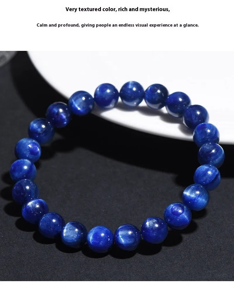 Natural blue grade 7A crystal bracelet with geometric bead and Ruyi charm on wrist.