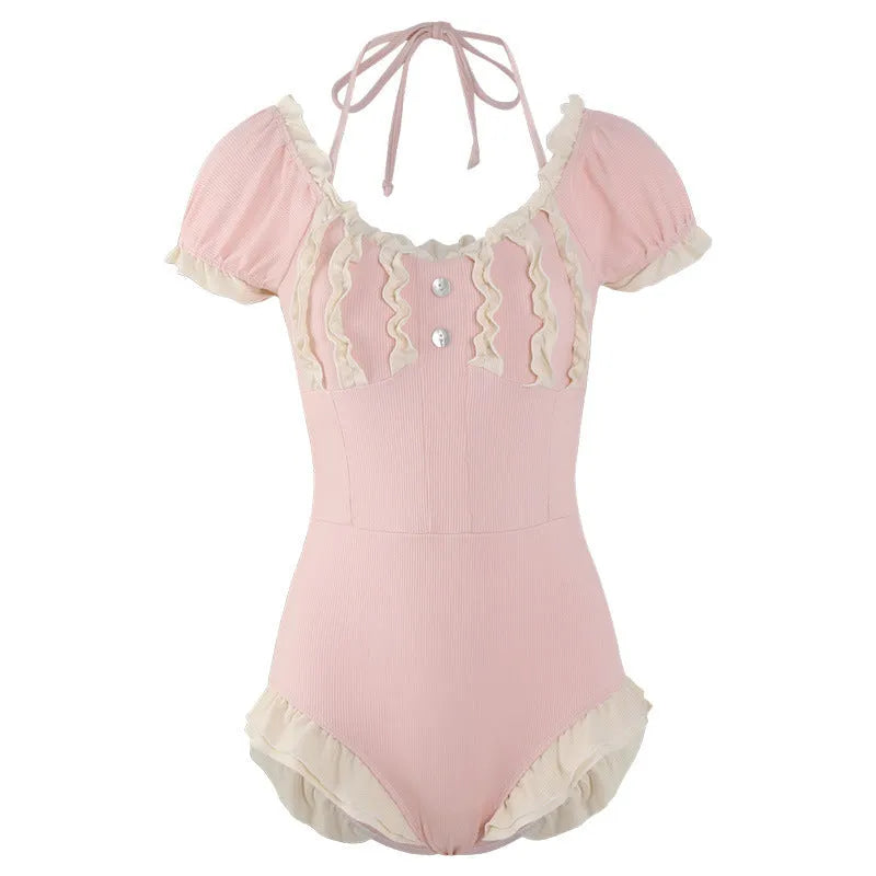 Pink women's one-piece swimsuit made from nylon fabric in conservative design