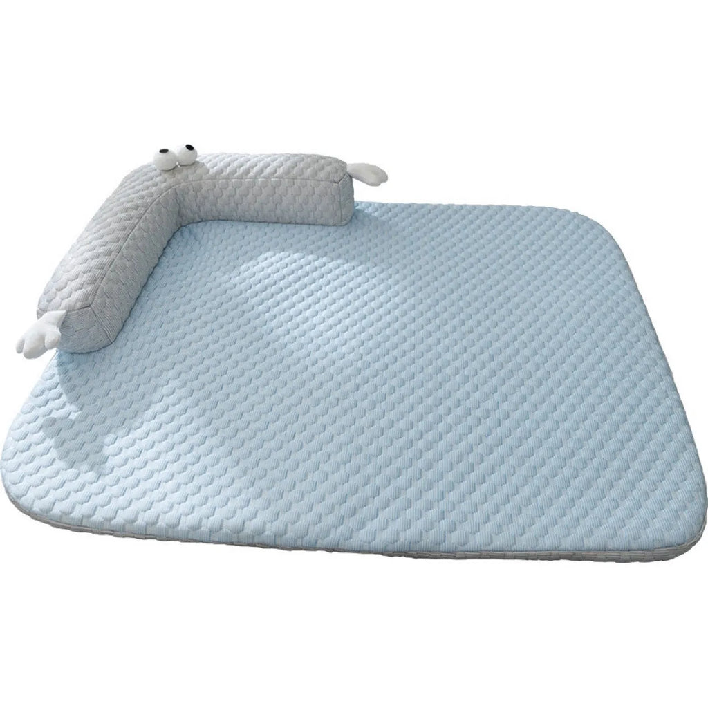 Blue monster design non-slip pet cooling bed for a dog on a hardwood floor.