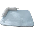 Blue monster design non-slip pet cooling bed for a dog on a hardwood floor.