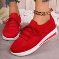 Women's low-top lace-up casual sneakers in red, black, and blue with a fly-knit pattern and round toe.